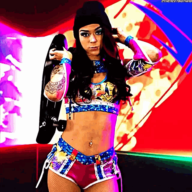 a female wrestler holding a skateboard in front of a colorful background with the hashtag #thenextbigthing