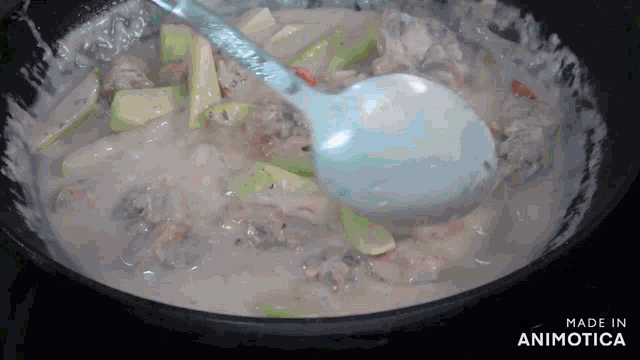 a spoon is being used to stir a stew in a pan made in animotica