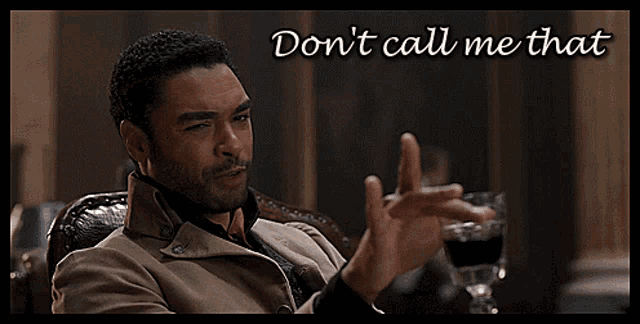 a man sitting in a chair with the words " don 't call me that " written above him