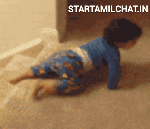a baby is crawling on the floor in front of a sign that says startamilchat.in