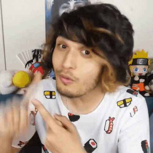 a man with a beard is wearing a shirt that has sushi on it