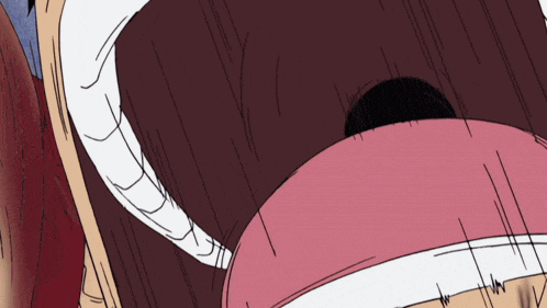 a close up of a person 's mouth with a white tooth