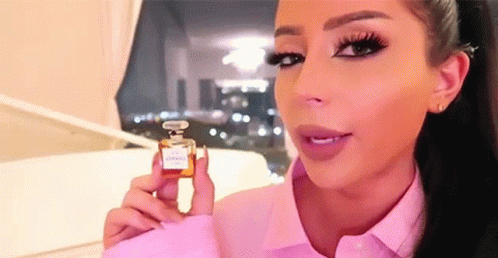Wink Small Perfume GIF - Wink Small Perfume Funny Face GIFs