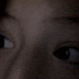 a close up of a person 's face with their eyes open