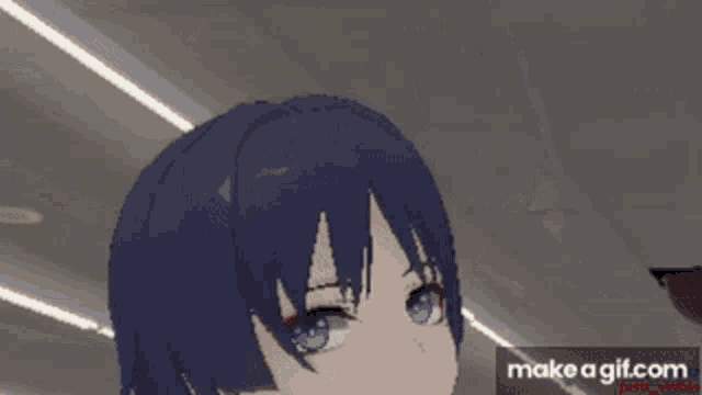 a gif of a girl with blue eyes and black hair is being made on make a gif.com