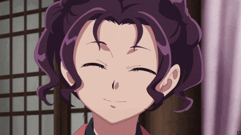 a woman with purple hair is smiling and looking at the camera