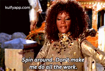 a woman in a gold dress is saying `` spin around . don 't make me do all the work . ``