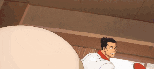 a man in a white shirt and red collar is standing next to a large egg