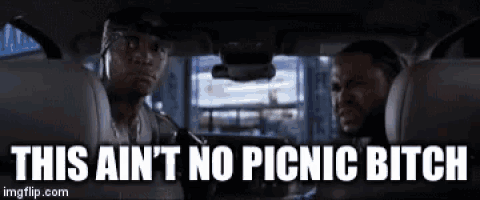two men are sitting in the back seat of a car and they are talking to each other .