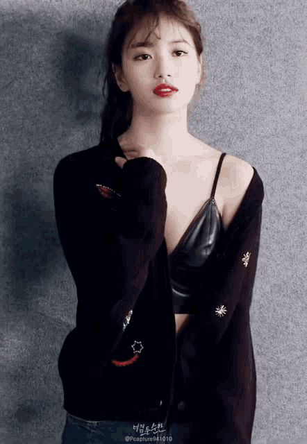 a woman wearing a black sweater and a black bra has a photo taken by capture941010