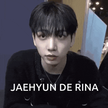 a close up of a person 's face with the words jaehyun de rina written on it