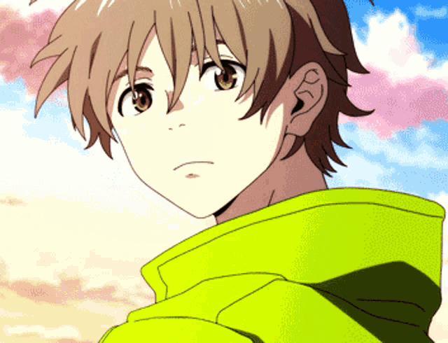 a close up of a person 's face with a yellow hoodie on