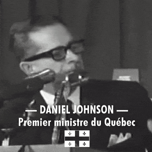 a black and white photo of a man speaking into a microphone with the caption daniel johnson premier ministre du quebec