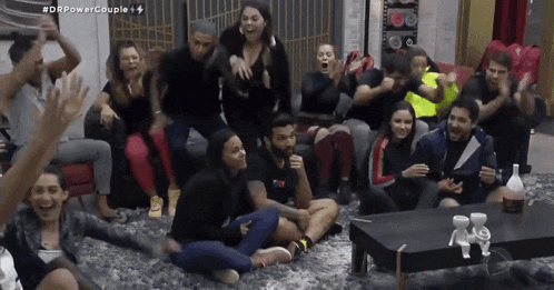 a group of people are sitting in a room with the hashtag #dfpowercouple