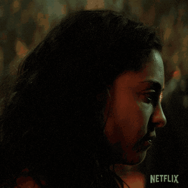 a close up of a woman 's face with netflix written in the corner