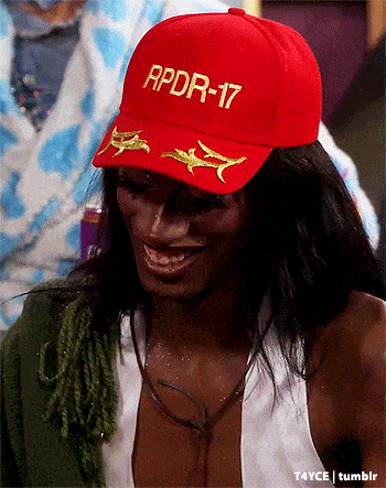 a woman wearing a red hat with apdr-17 written on it