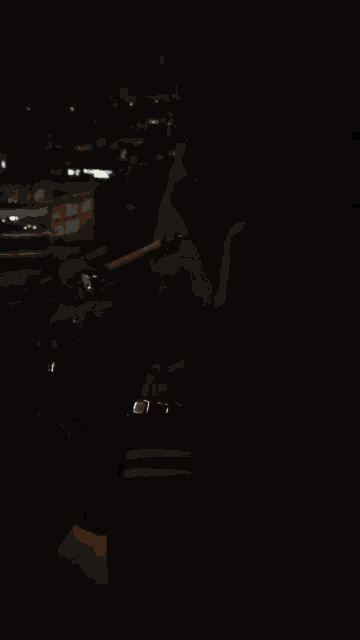 a man lighting a cigarette in the dark