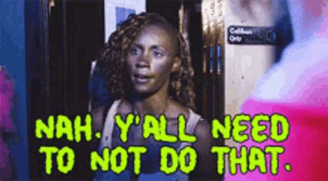 a woman is standing in front of a sign that says nah y all need to not do that