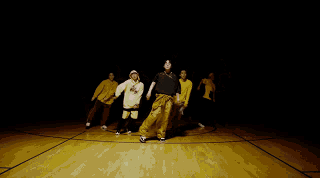 a group of people are standing in a circle with their arms outstretched