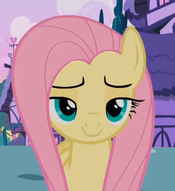 a cartoon pony with a pink mane and blue eyes is smiling