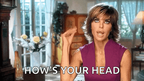 a woman in a purple tank top is making a funny face and says `` how 's your head '' .