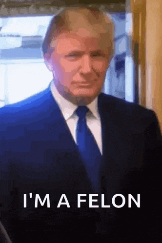 a man in a suit and tie with the words i 'm a felon on the bottom