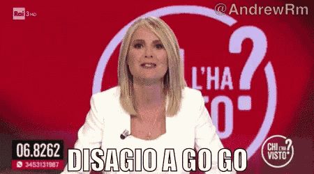 a woman is sitting in front of a sign that says disagio a go go on it