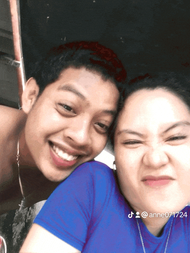 a man and a woman are posing for a picture and the woman 's username is anne071724