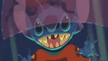 a close up of a cartoon character with a huge mouth and teeth holding an umbrella .