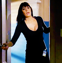 a woman in a black shirt has a name tag with the number 00 on it