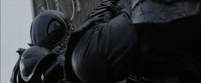 a close up of a person wearing a mask and gloves