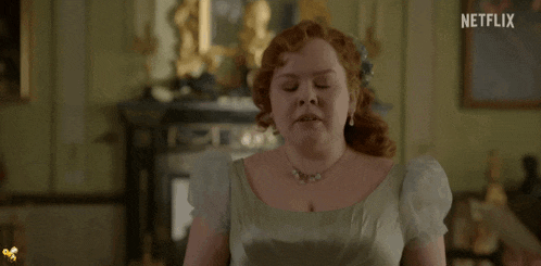 a woman with red hair is in a room with a netflix logo on the bottom