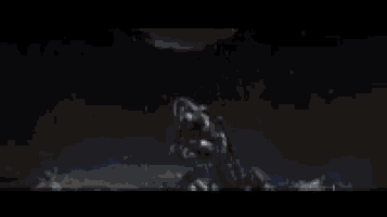 a robot is flying through the air in a dark room in a video game .