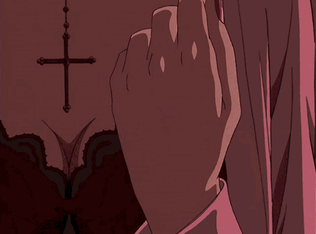 a woman 's hand with purple nails is holding a flame in front of a cross