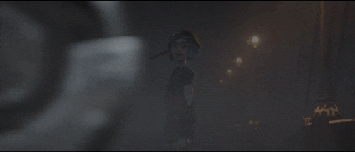 a blurred image of a person holding a gun in a dark room