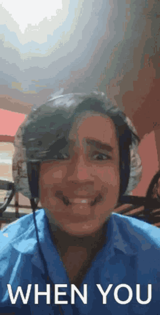 a man wearing headphones is smiling with the words when you written below him
