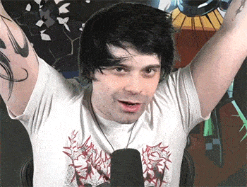 a man with his arms in the air wearing a white t-shirt with a graphic on it