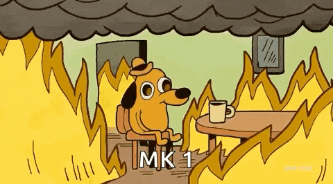 a dog is sitting at a table in front of a fire .