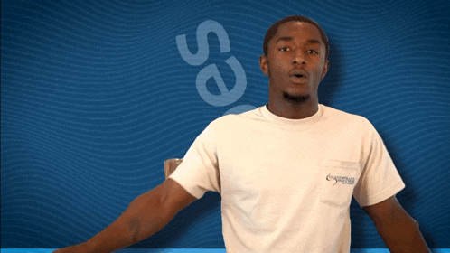 a man stands in front of a blue background with the word seas written on it