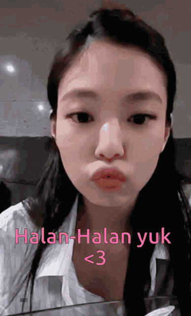 a woman making a funny face with the words halan-halan yuk < 3 above her