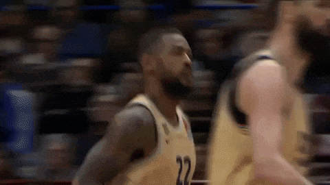 a blurry picture of a basketball player wearing the number 22 jersey