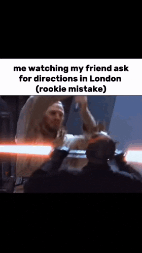 a man is giving another man a high five while holding a lightsaber in a meme .