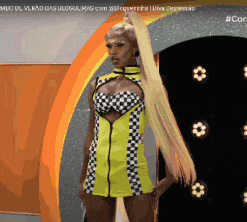 a woman in a yellow and black checkered dress with a ponytail