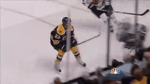 a hockey player with the number 28 on his jersey is standing on the ice