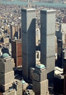 an aerial view of a city with two skyscrapers in the foreground .