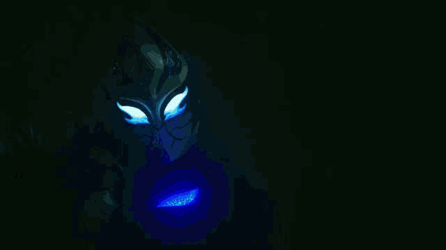 a person in a dark room with a blue light on their chest