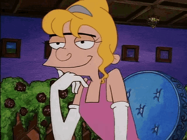 a cartoon character with blonde hair and white gloves is smiling