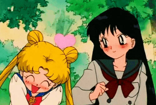 a girl with a heart on her head stands next to a girl with a heart on her head