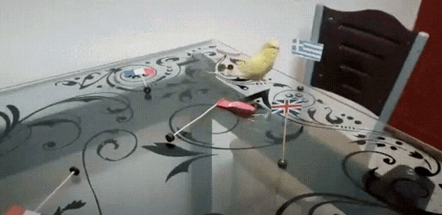 a table with a few flags on it including a french flag