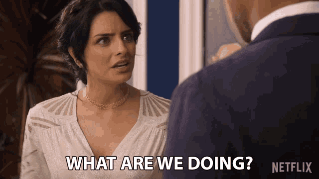 a woman talking to a man with the words what are we doing on the bottom